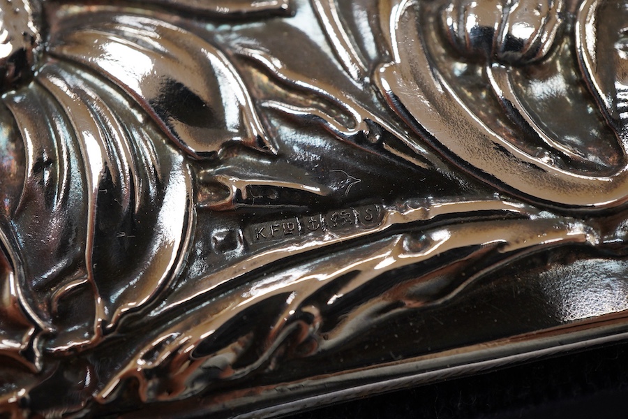 An Elizabeth II silver mounted photograph frame, with heart shaped aperture, Keyford Frames Ltd, Birmingham, 1992, 19cm by 14.4cm, together with an Italian 925 mounted rectangular photograph frame.